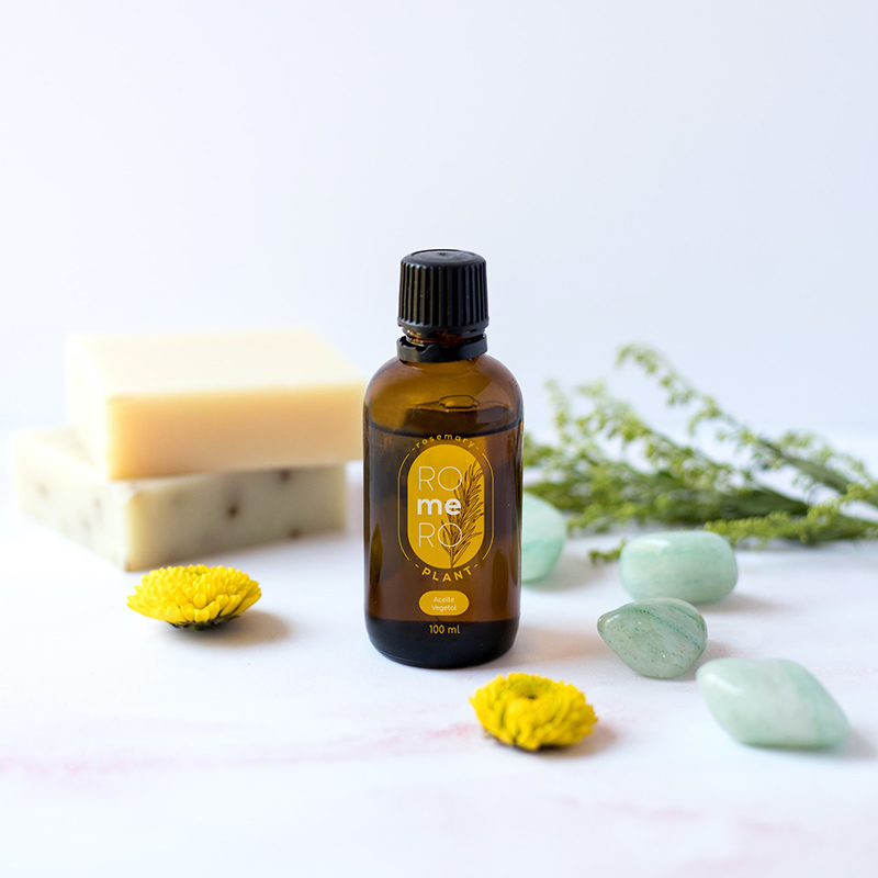 small bottle with rosemary vegetable oil and yellow label