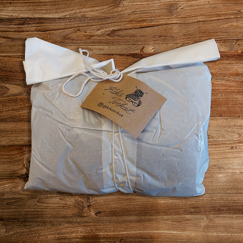 package with kraft paper tag and stamped logo
